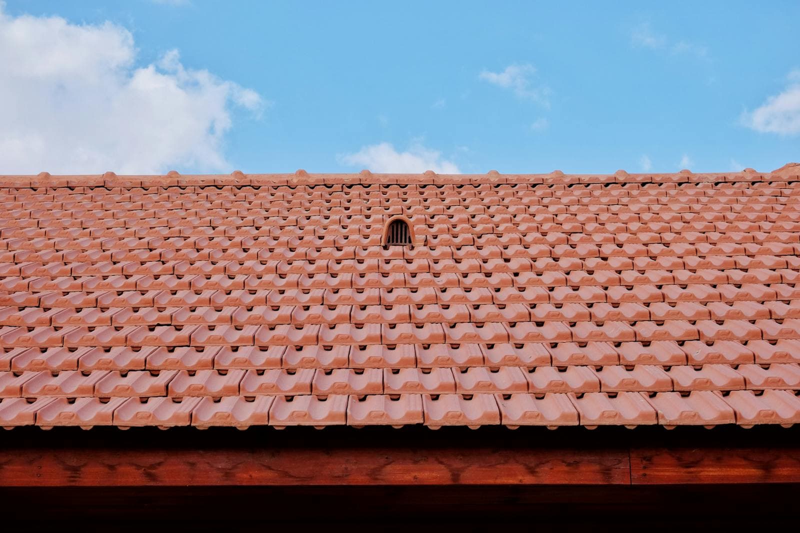 Spanish clay tile roof with warm terracotta color on residential home